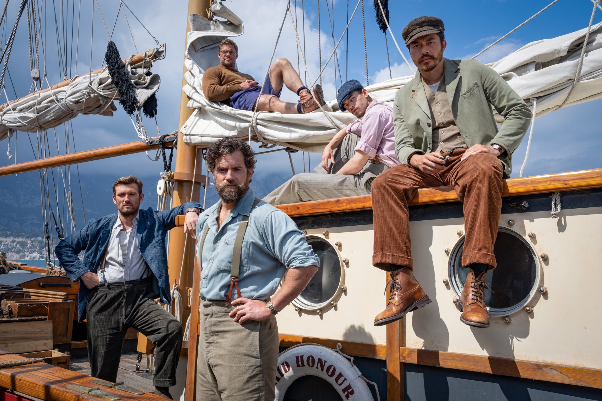 The cast of "The Ministry of Ungentlemanly Warfare" on a boat set.